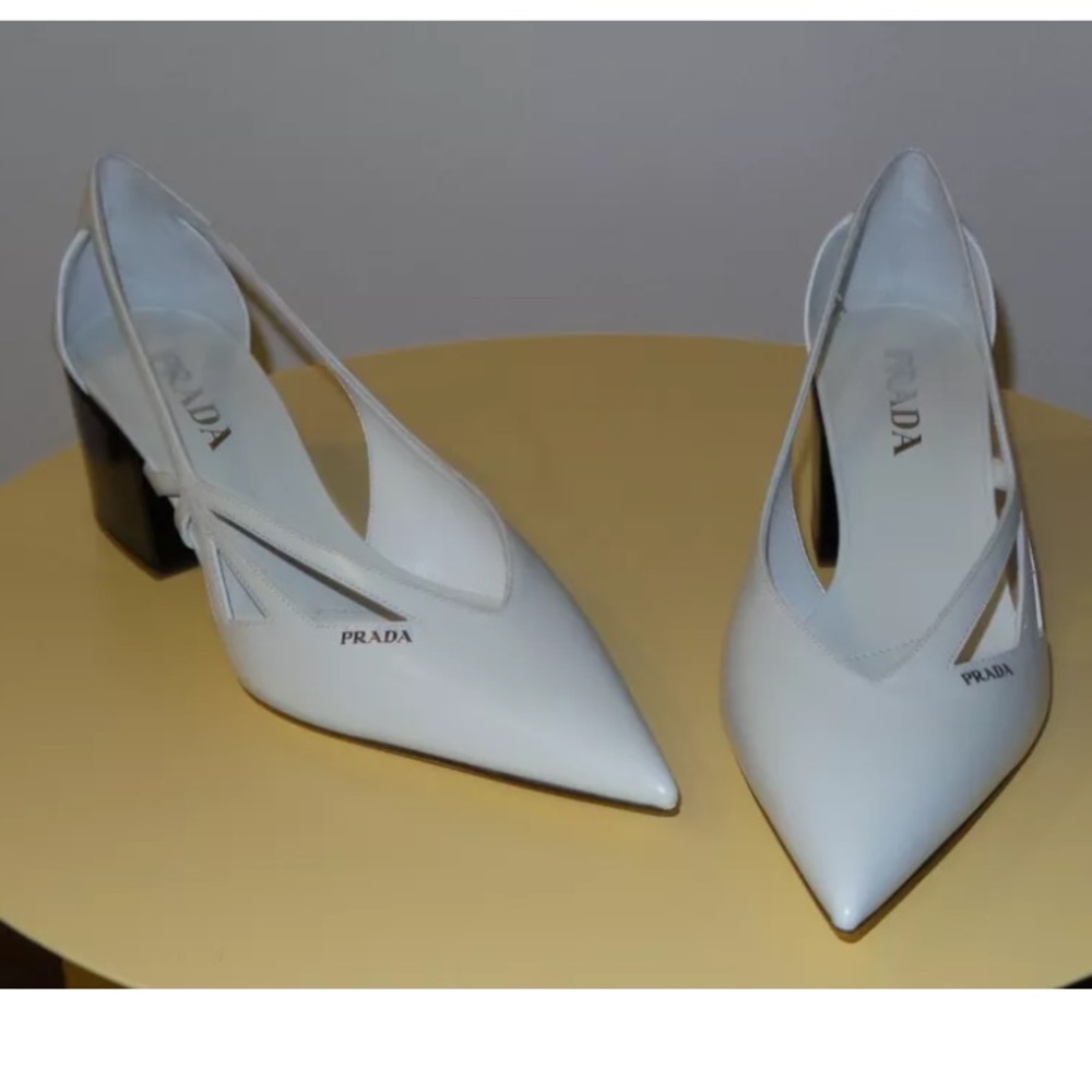 $1370 PRADA LOGO WHITE LEATHER PUMPS
